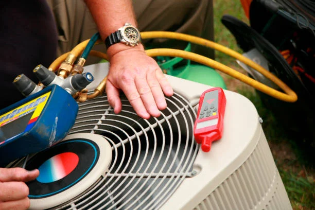 Air-conditioning maintenance with gauges, hoses and a temperature meter